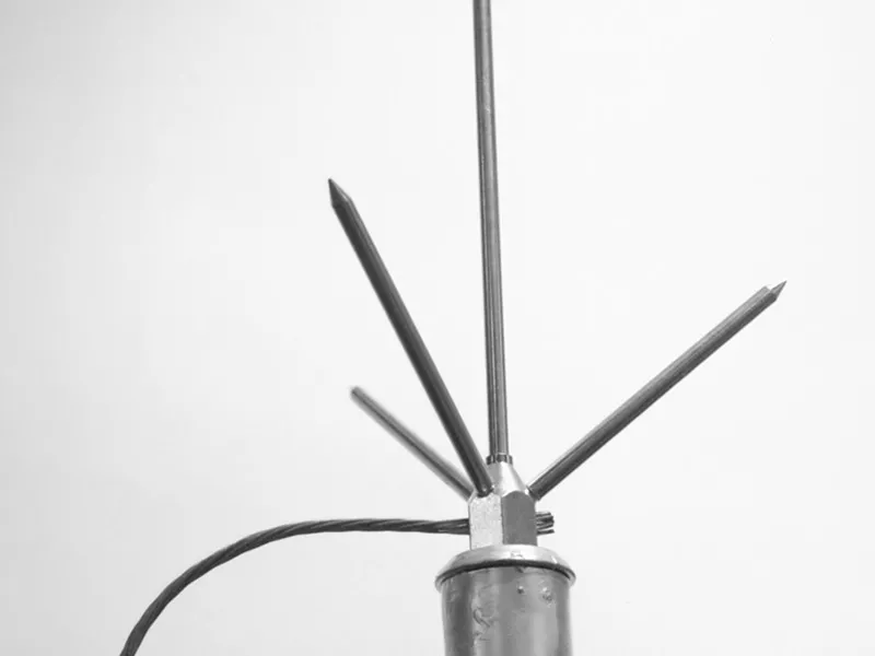 Close-up of a multi-point lightning air terminal and cable connection